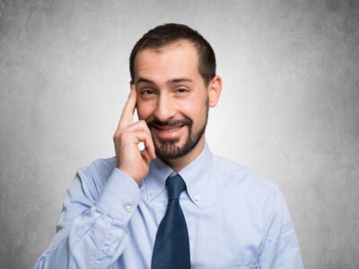 person with finger on his temporal lobe as a "smart gesture"